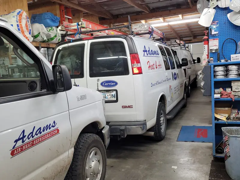 Adams service vans at the shop